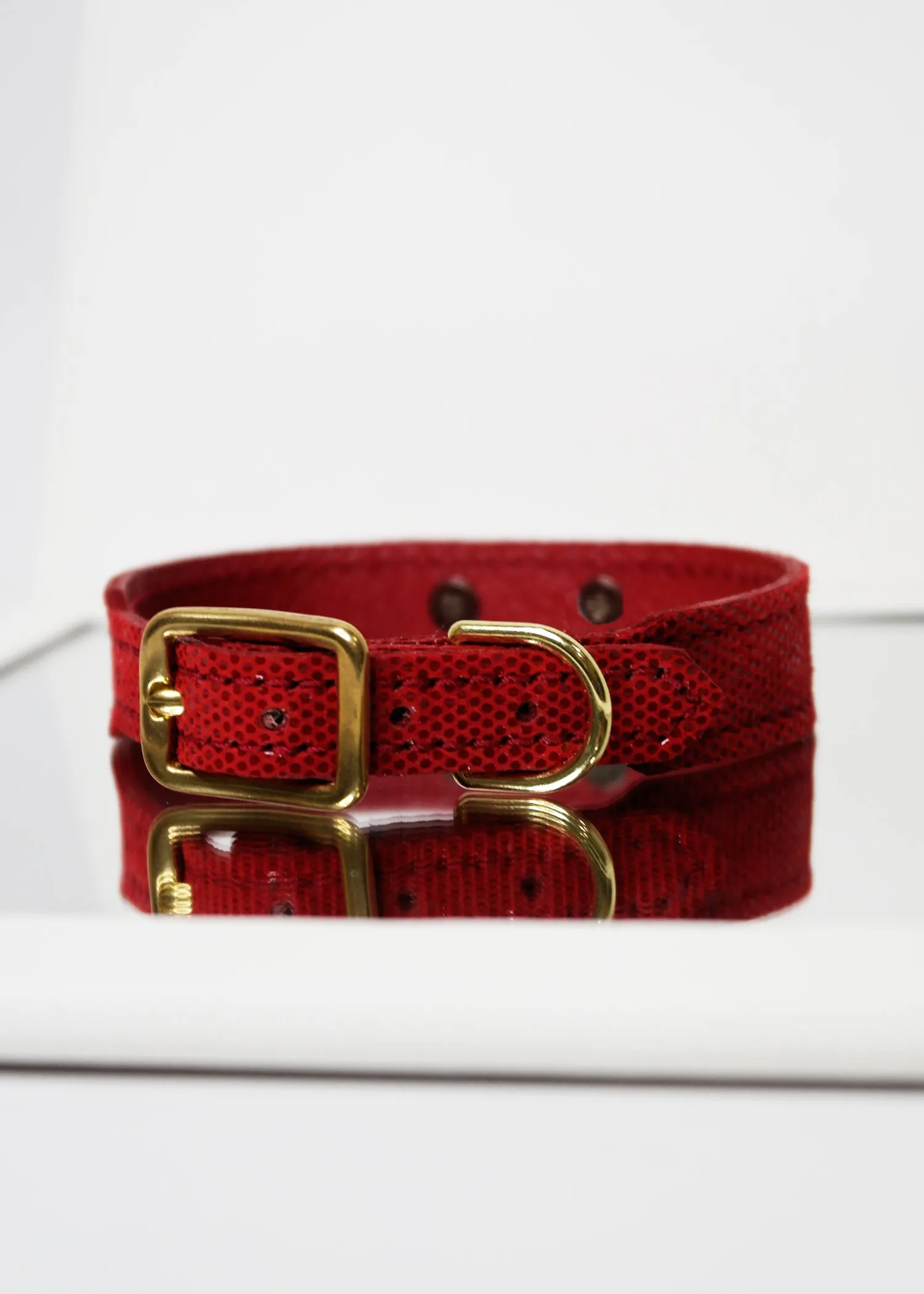 RED PEBBLE EMBOSSED LEATHER WITH ENAMEL BOW