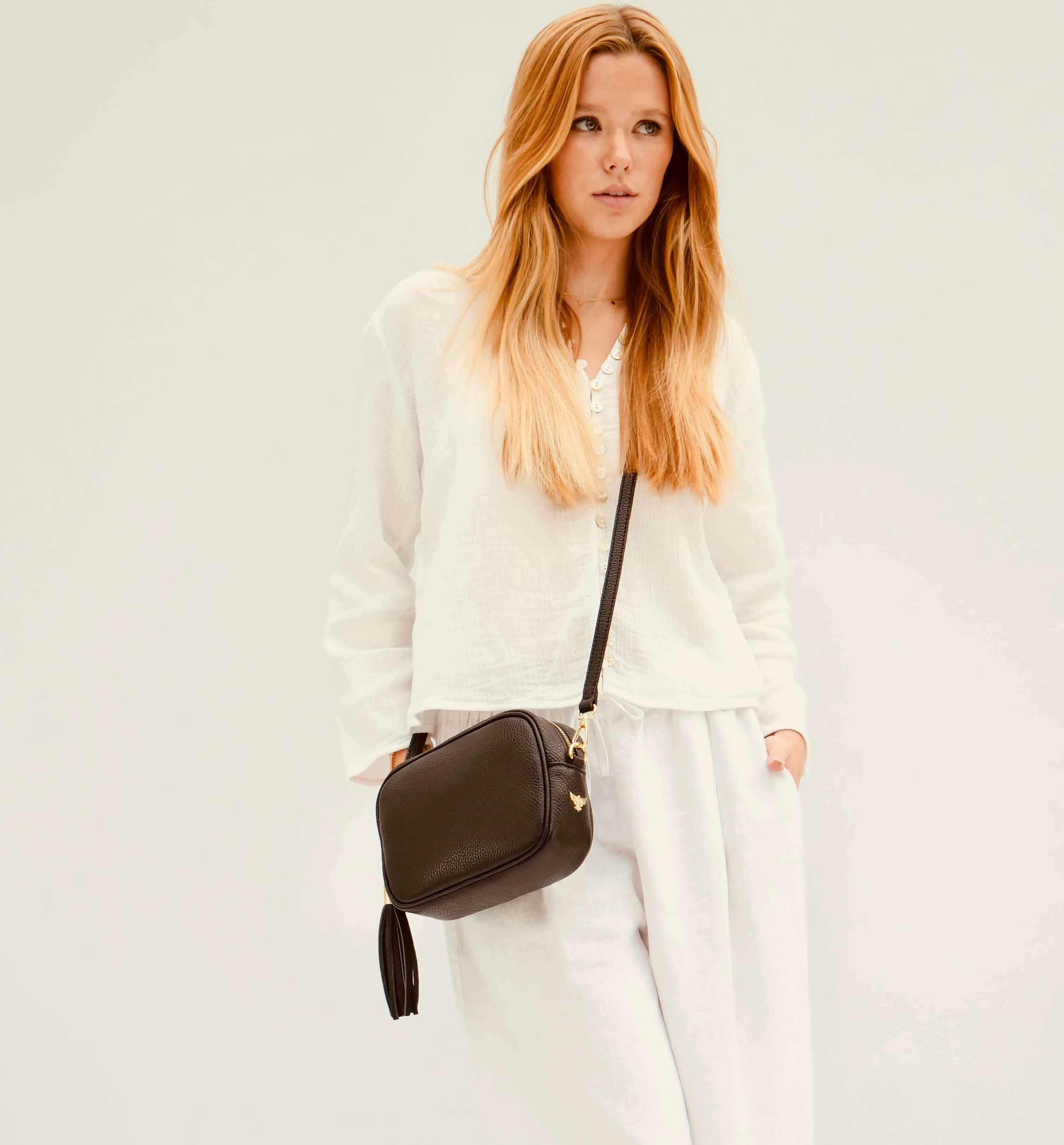 The Tassel Black Leather Crossbody Bag With Black & Red Aztec Strap