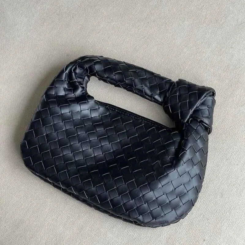 Woven Mini Satchel Bag Made from Vegan Leather with Elegant Design and Silver Accents